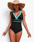 Beach Rose Co. one-piece swimsuit in black and turquoise with a V-neckline, worn by a model with a sun hat.