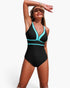 Beach Rose Co. black and turquoise color block V-neck one-piece swimsuit with stretch fabric on a smiling model.
