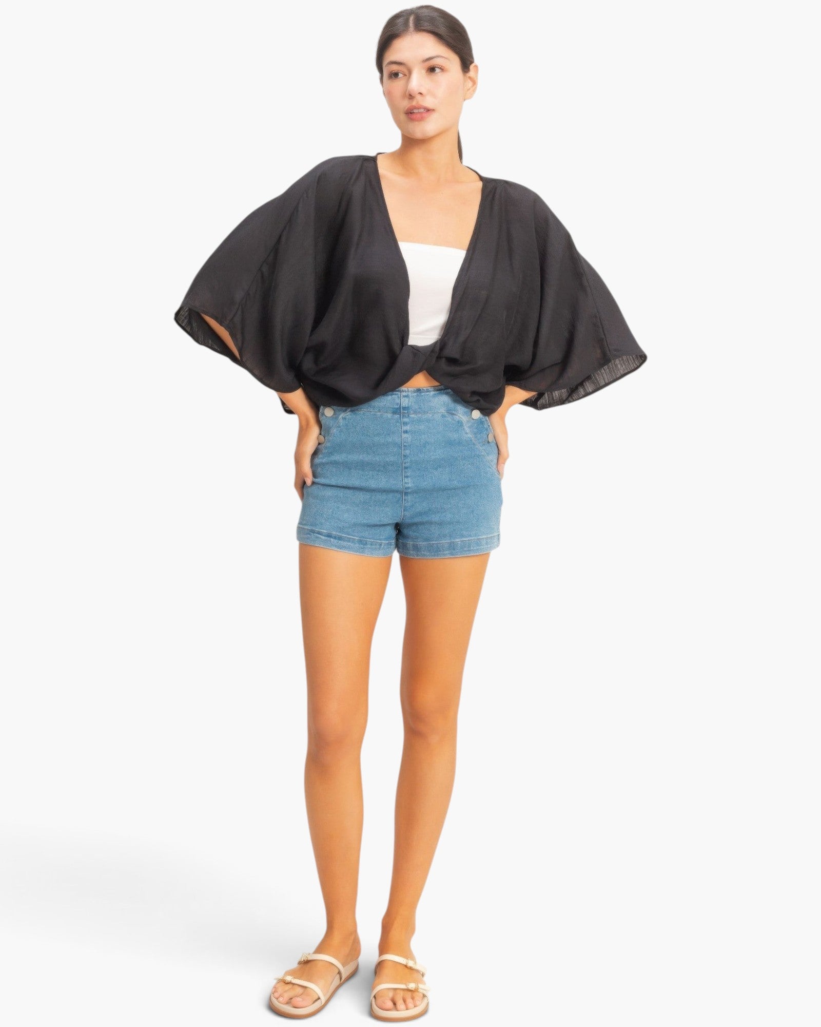 Beach Rose Co. black oversized twist knot top with V-neck and loose sleeves worn with denim shorts