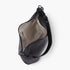 Beach Rose Co. black vegan leather shoulder bag with a faux strap design, silver hardware, and a zippered interior.