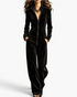 Beach Rose Co. black velour wide-leg jumpsuit with a stand collar, front zipper, and long sleeves.