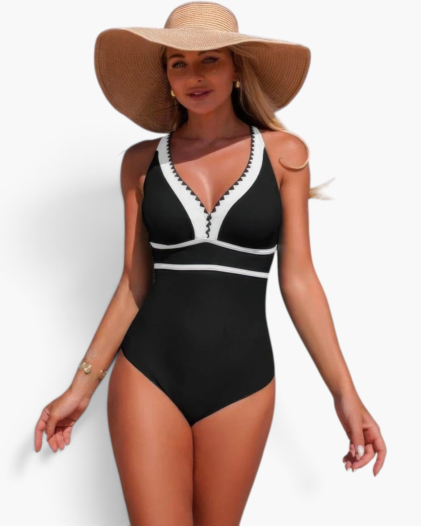 Beach Rose Co. one-piece swimsuit in black and white with a V-neckline, worn by a woman with a wide-brim straw hat.