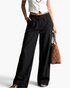 Beach Rose Co. black wide-leg cotton blend pants featuring oversized front flap pockets and a flat front waistband.