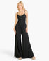 Beach Rose Co. black button-front wide-leg jumpsuit in soft stretch jersey fabric worn by a blonde model