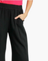 Beach Rose Co. black wide-leg pants in a linen-cotton blend with an elastic waistband and side pockets