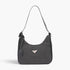 Beach Rose Co. black faux leather shoulder bag with a woven texture and distinctive triangle hardware detail.