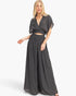 Beach Rose Co. black two-piece set with a cropped collared wrap top and flowing wide-leg pants on a blonde model