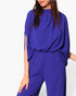 Beach Rose Co. royal blue mock neck caftan jumpsuit in soft textured fabric with a relaxed flowing silhouette.