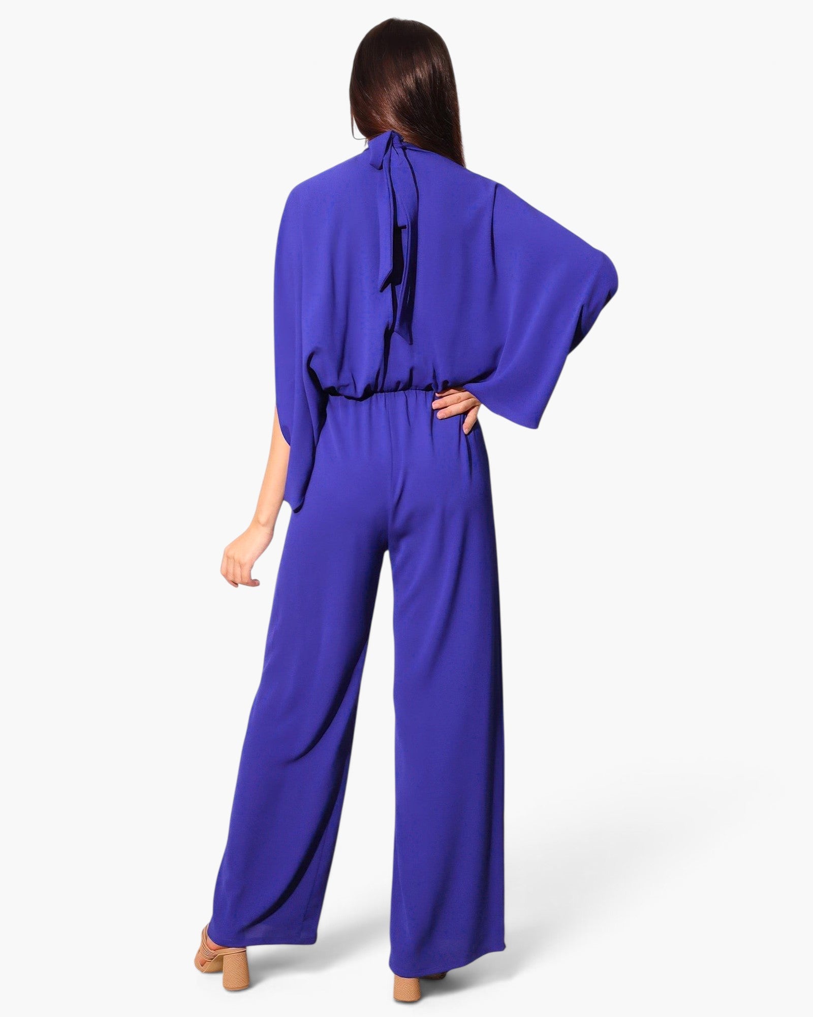 Beach Rose Co. royal blue textured mock neck caftan jumpsuit with wide legs and back tie detail, back view