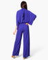 Beach Rose Co. royal blue textured mock neck caftan jumpsuit with wide legs and back tie detail, back view