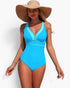 Beach Rose Co. blue color block one-piece swimsuit with a V-neckline and stretch fabric worn by a woman with a sun hat.