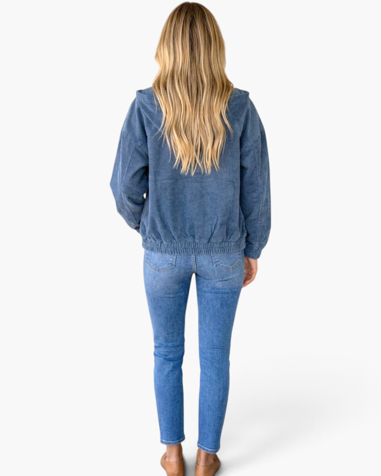Beach Rose Co. blue corduroy hooded jacket with a zip front, elastic cuffs, and hem, worn by a blonde model.
