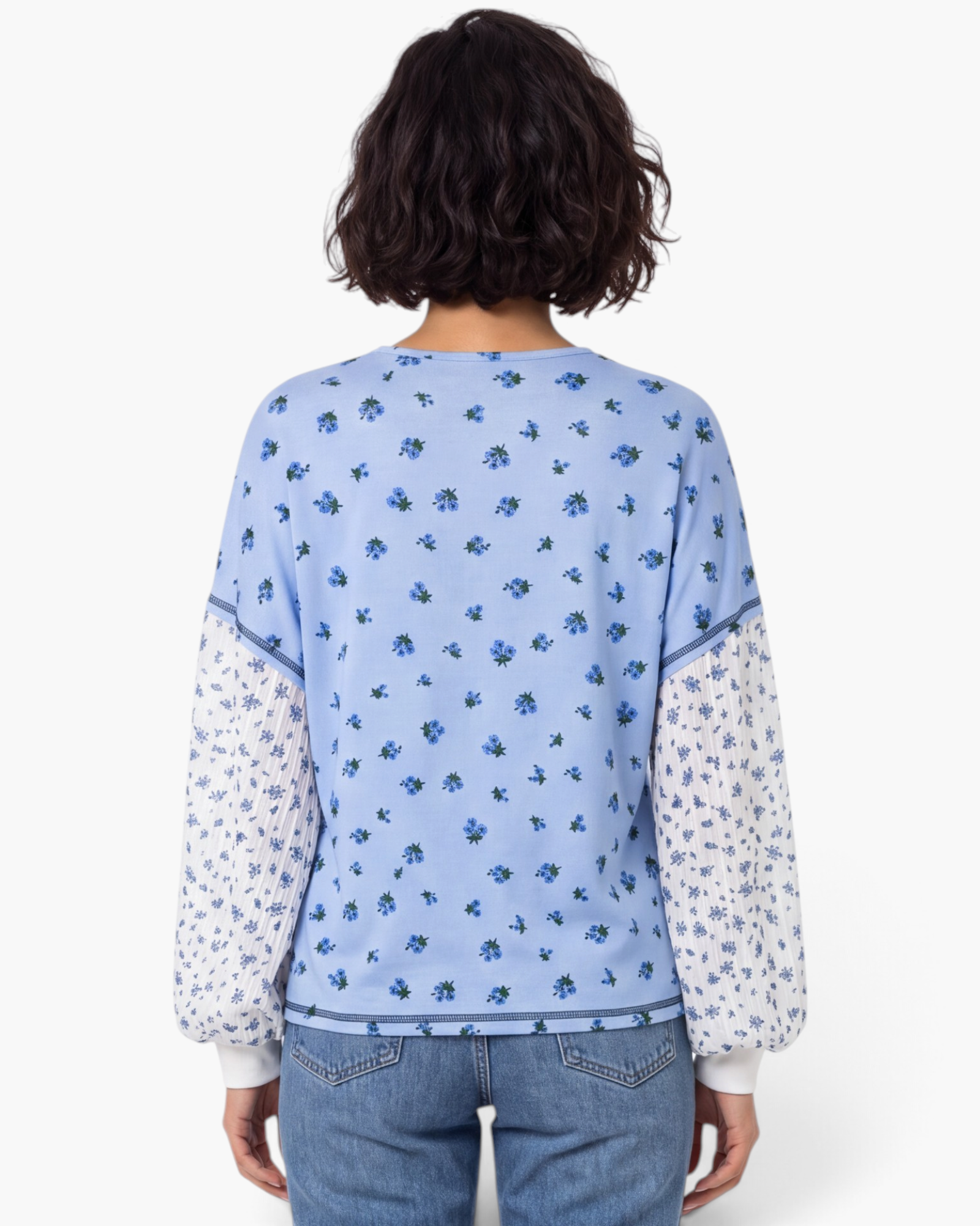 Beach Rose Co. blue floral print long sleeve top with contrast pleated sleeves and buttoned cuffs.