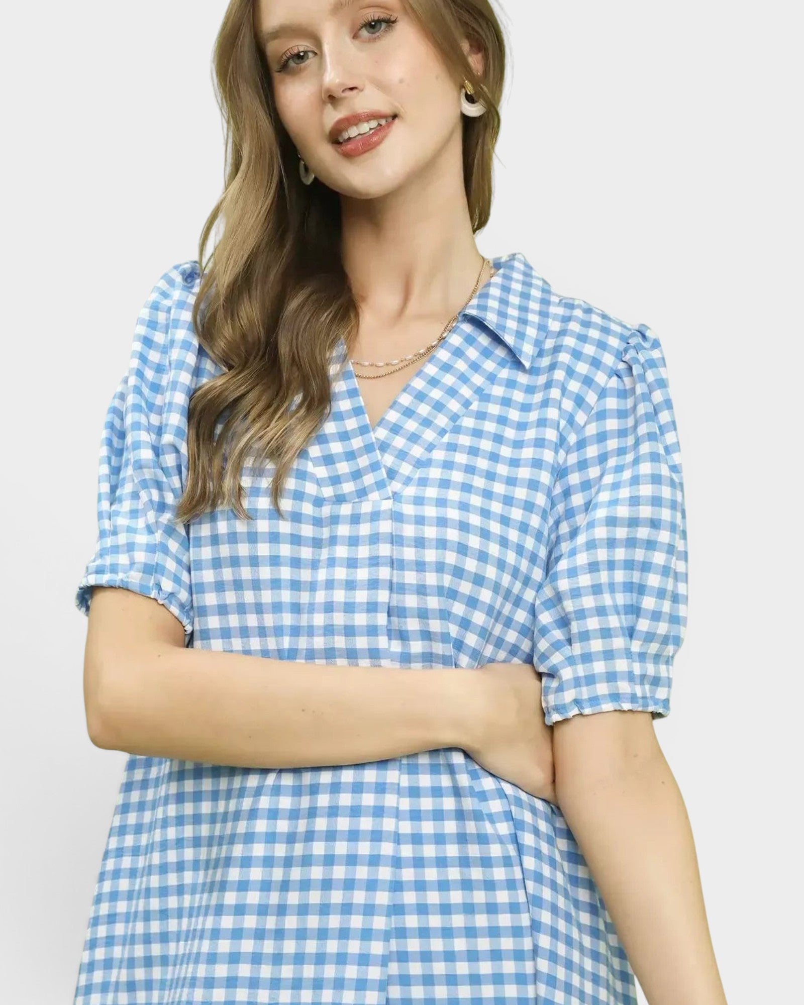 Beach Rose Co. blue and white gingham midi dress with collared split neckline, short puff sleeves, and ruffle hem.