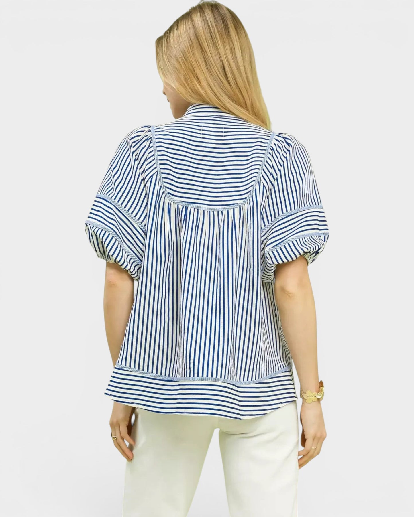 Beach Rose Co. blue and ivory striped puff sleeve babydoll top made of cotton and polyester blend.