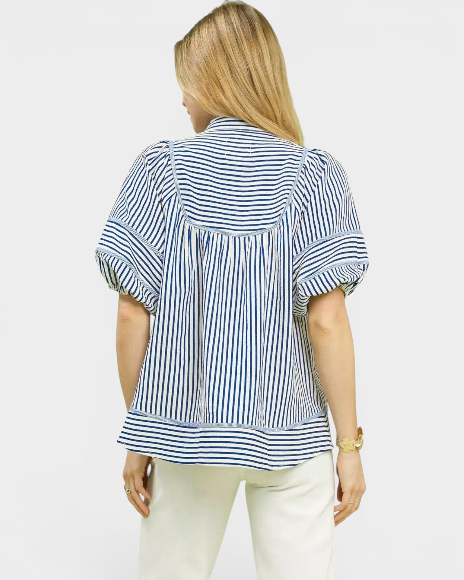 Beach Rose Co. blue and ivory striped puff sleeve babydoll top made of cotton and polyester blend.