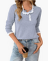 Beach Rose Co. light blue knit sweater with white scalloped floral lace trim on the neckline, placket, and cuffs.