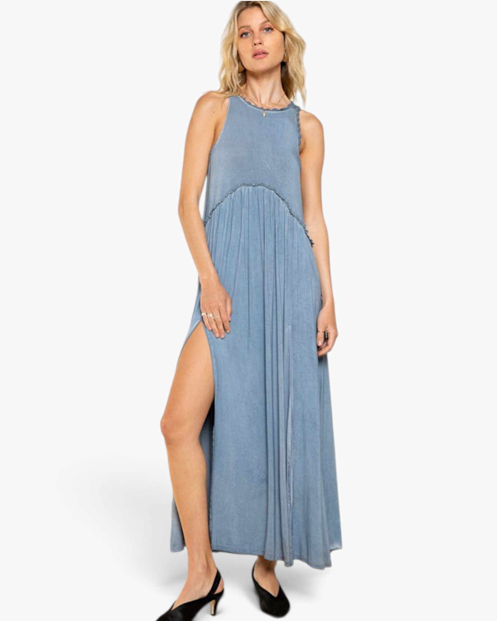 Beach Rose Co. blue racerback maxi dress with pleated skirt, scalloped trim, and high side slit on a blonde model