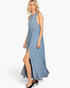 Beach Rose Co. blue maxi dress with racerback, pleated skirt, and side slit worn by a blonde model