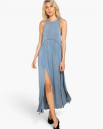 Beach Rose Co. blue maxi dress with racerback, pleated skirt, scalloped trim, and side slits on a blonde model