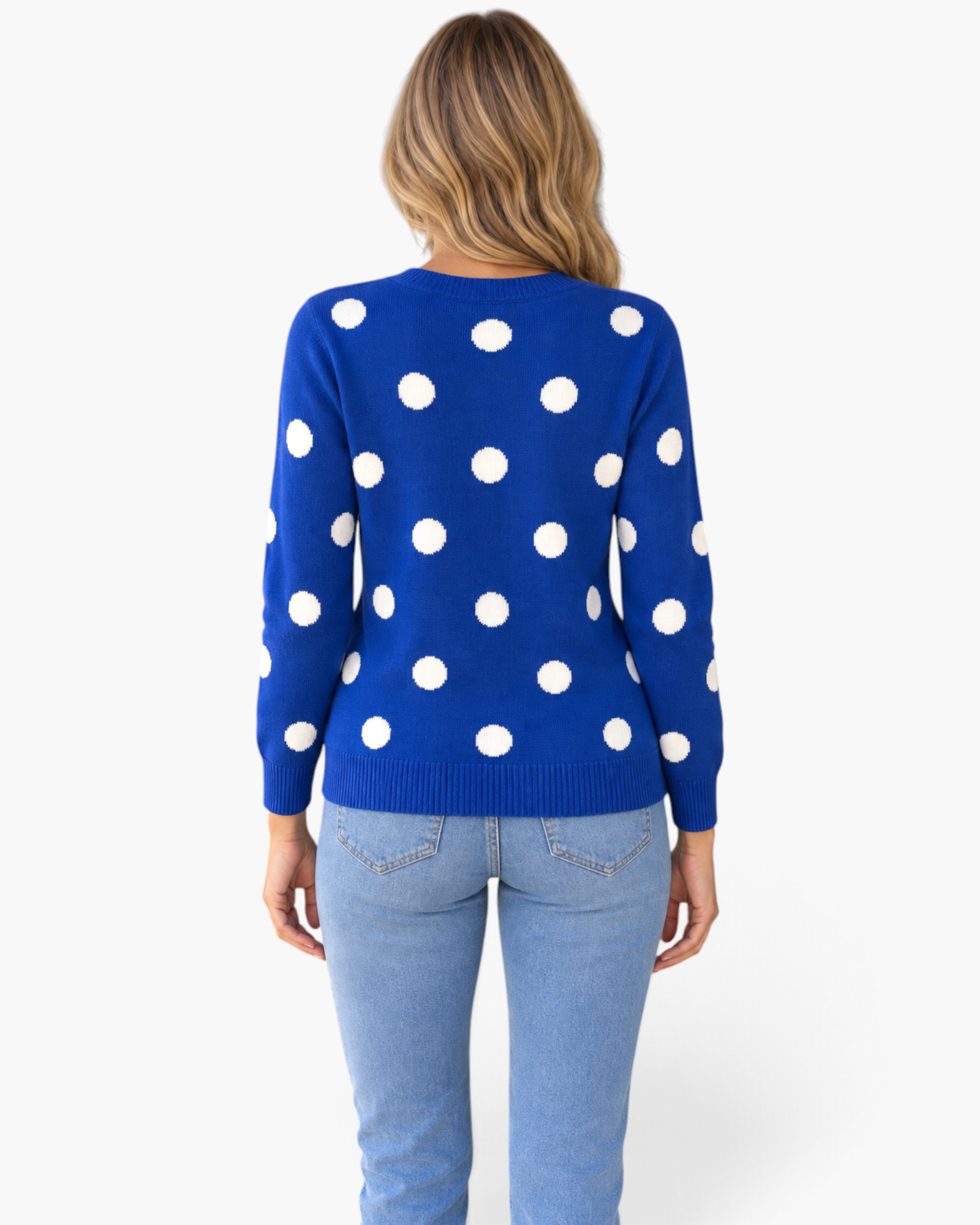 Beach Rose Co. royal blue knit cardigan with oversized white polka dots worn by a model from the back view.