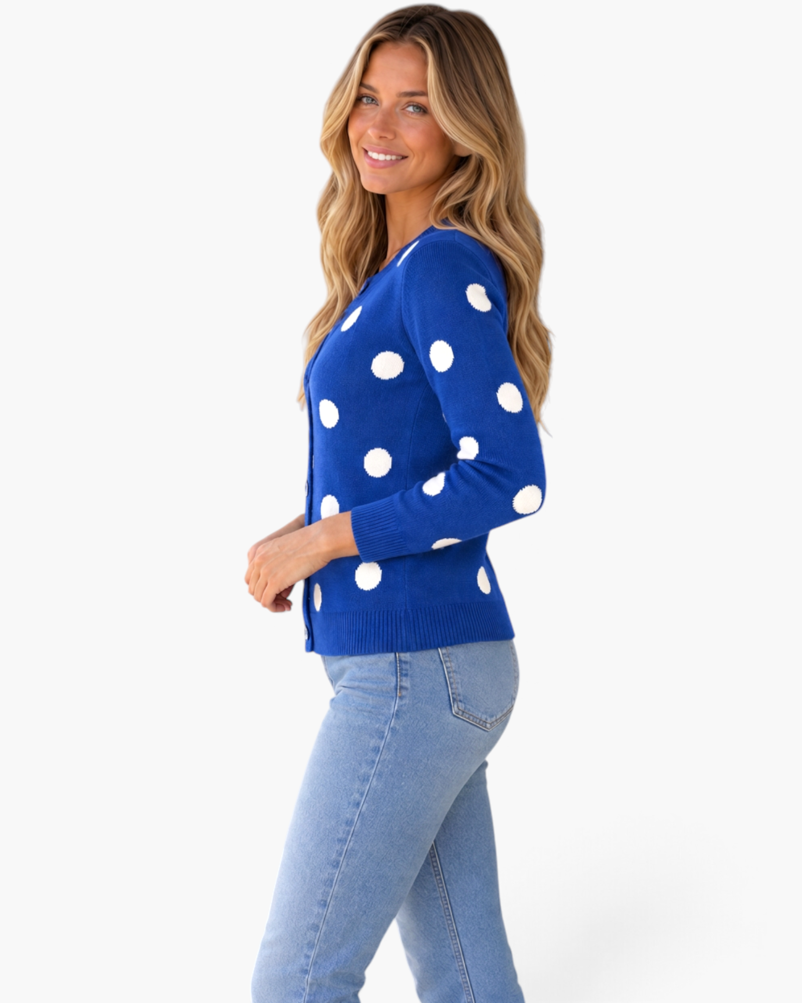 Beach Rose Co. royal blue cardigan with white polka dots, button-front, and ribbed trim worn by a smiling woman.