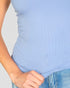 Beach Rose Co. light blue ribbed knit cami top worn with denim jeans for a comfortable and stylish look.