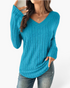 Beach Rose Co. blue ribbed long sleeve knit top with a wide V-neckline and curved hem worn by a woman.