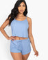 Beach Rose Co. light blue ribbed strappy top and matching shorts set worn by a model on a white background