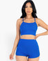 Beach Rose Co. royal blue ribbed cami crop top and matching ruched shorts set worn by a model against a white background