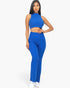 Beach Rose Co. royal blue ribbed mock neck crop tank top and matching bootcut pants set worn by a model.