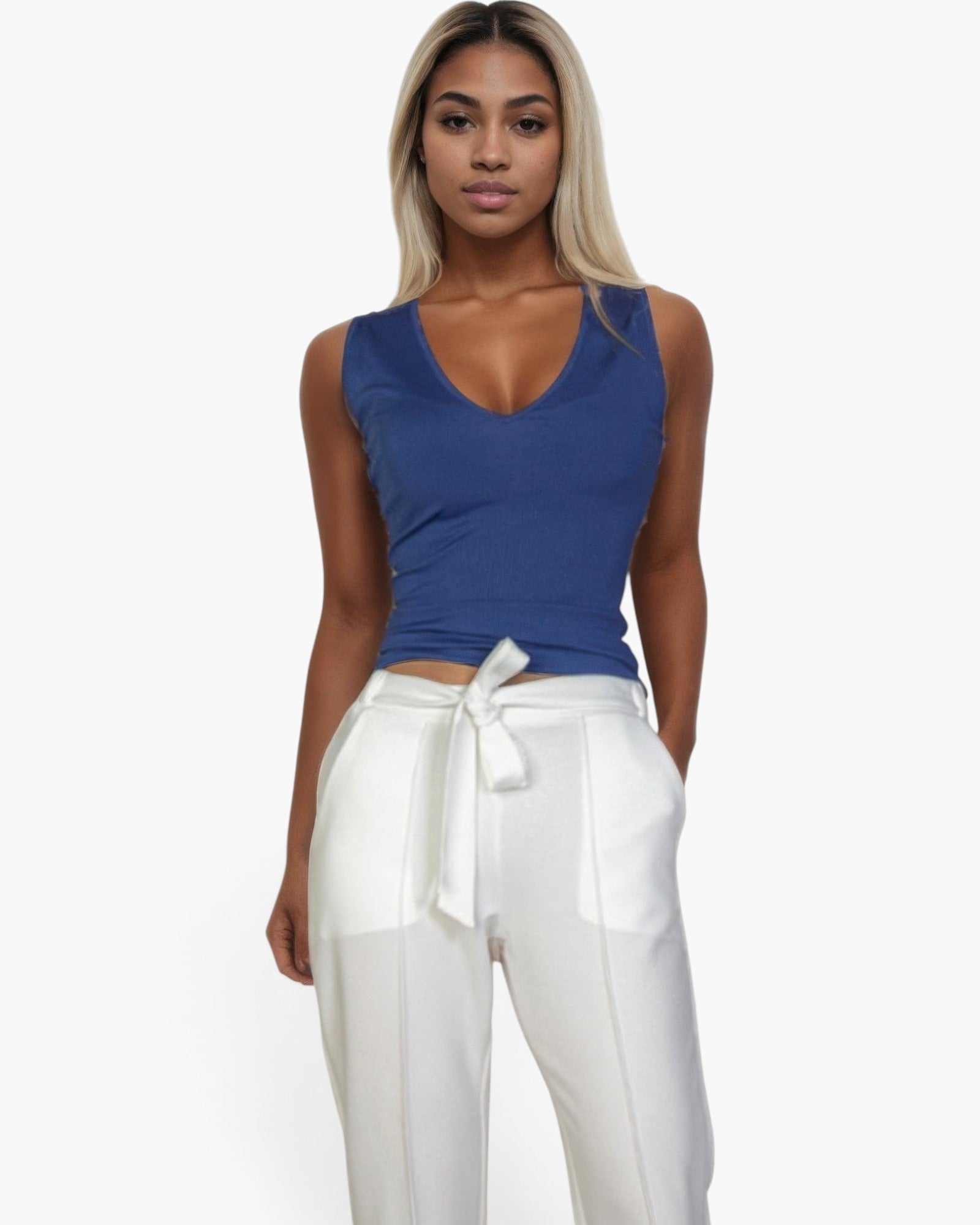 Beach Rose Co. blue ribbed V-neck sleeveless top worn by a blonde model with white trousers