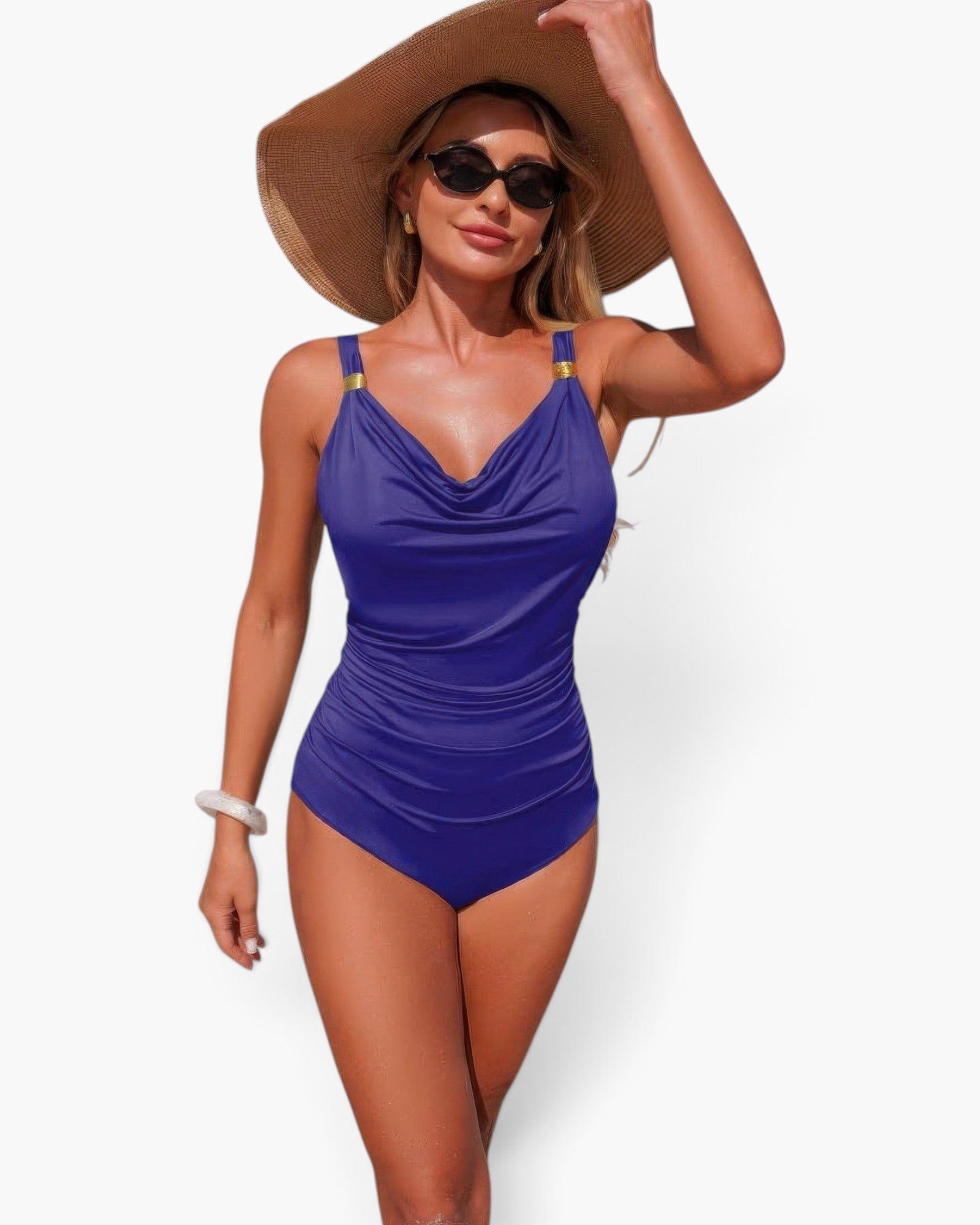 Beach Rose Co. blue one-piece swimsuit with V-neck, ruched tummy control, and gold strap accents on a model with a hat.