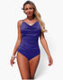 Beach Rose Co. blue one-piece swimsuit with a V-neckline, ruched tummy control design, and gold shoulder strap detail.