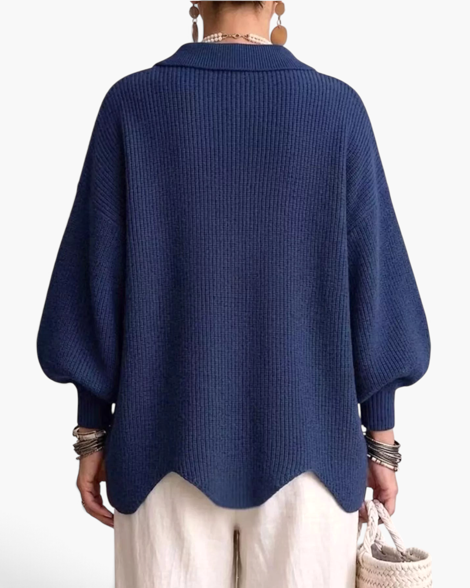 Beach Rose Co. blue ribbed knit cardigan with balloon sleeves, fold-over collar, and a scalloped hem, back view.