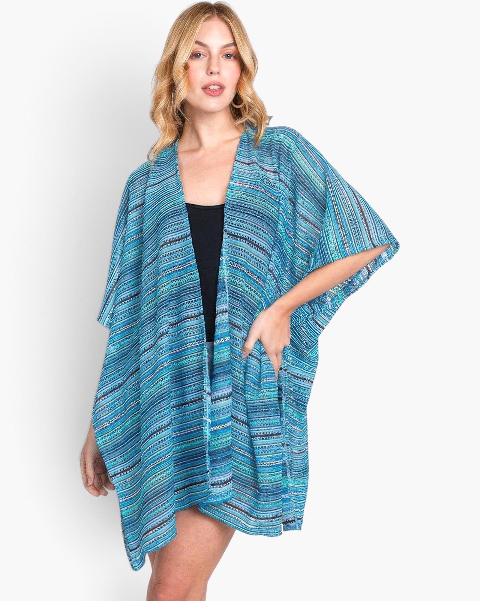 Beach Rose Co. multi-color blue stripe crochet open front cover-up worn by a blonde model over a black tank top.