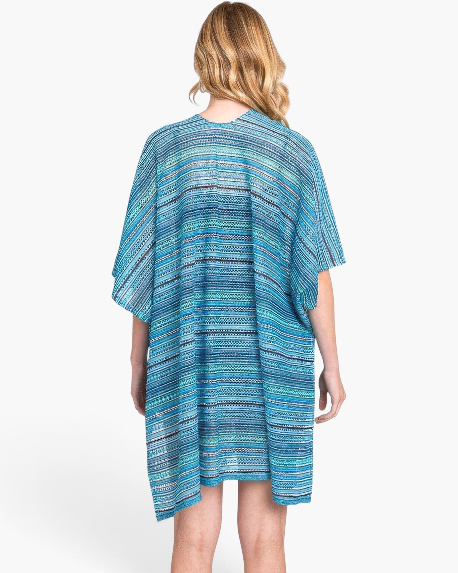 Beach Rose Co. multi-color blue stripe crochet cover-up with an open-knit design worn by a woman from the back.