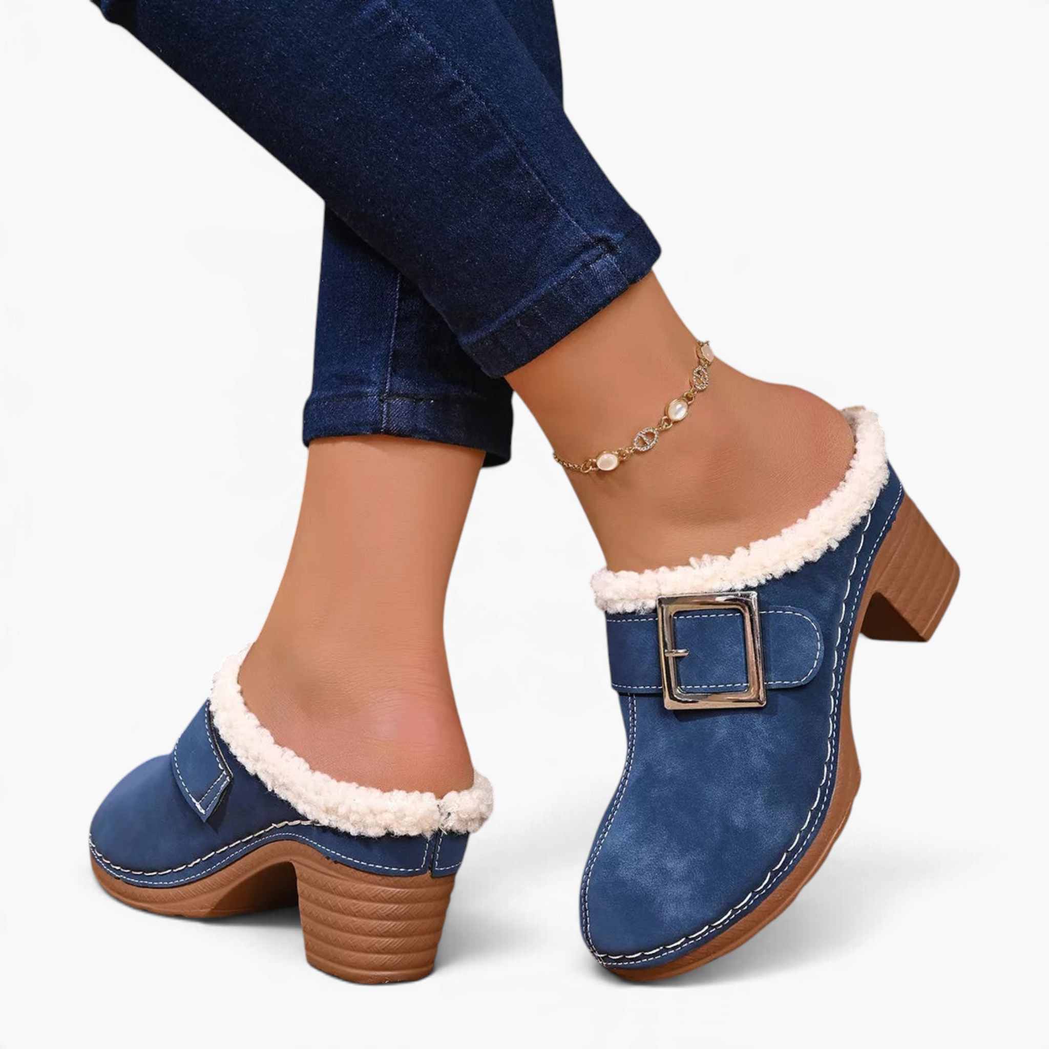 Beach Rose Co. blue suede clogs with fluffy white trim, oversized buckle, and chunky block heel worn with jeans