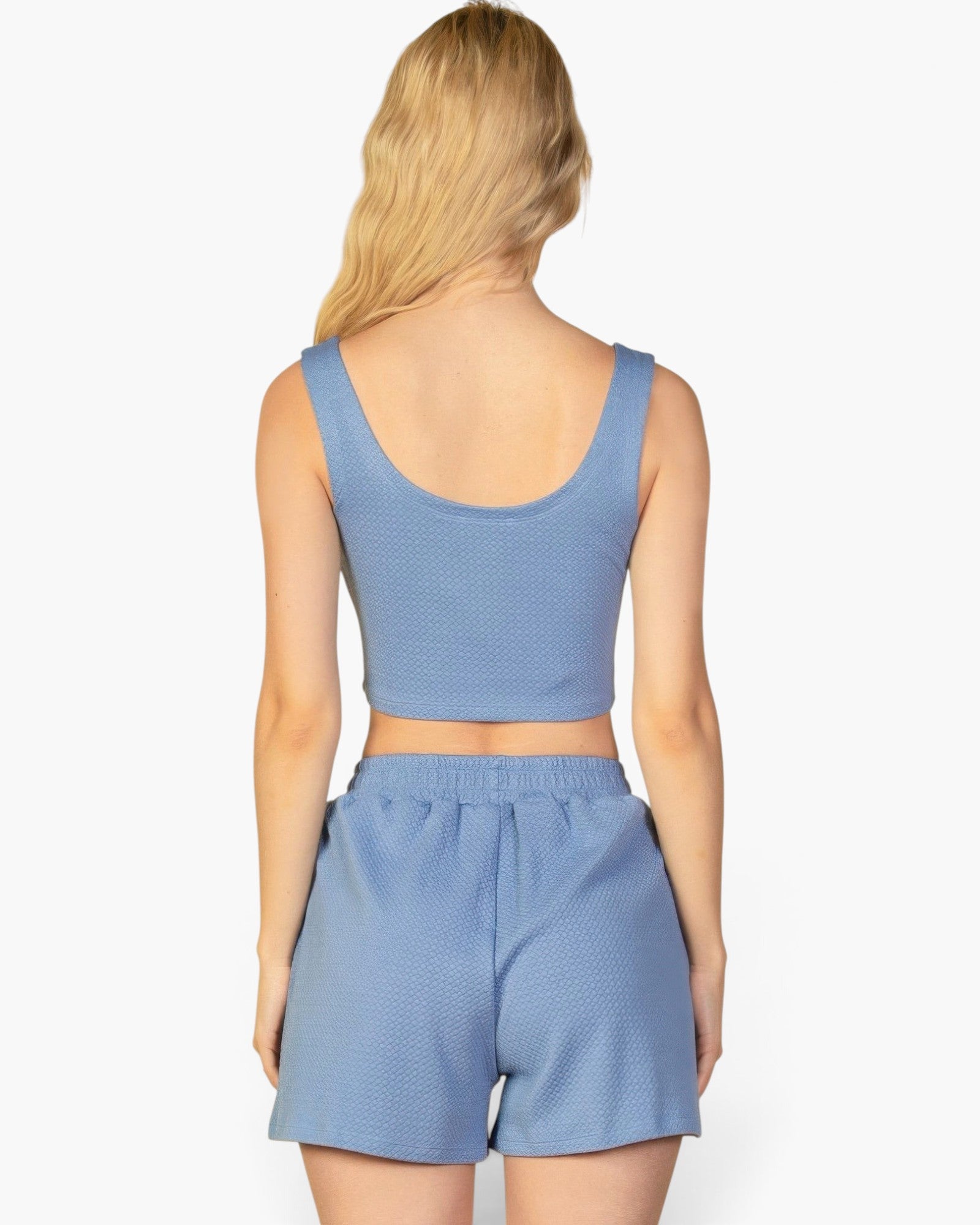 Beach Rose Co. blue textured crop tank top and shorts set viewed from the back on a blonde model