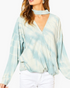 Beach Rose Co. blue tie-dye surplice top with a trendy choker neckline and long sleeves on a model