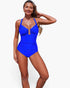 Beach Rose Co. blue one-piece swimsuit with V-neckline, U-ring detail, and high-waisted silhouette on a smiling model