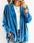 Beach Rose Co. blue velour open-front cardigan with patch pockets and relaxed fit worn over a white tee