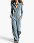 Beach Rose Co. blue velour wide-leg jumpsuit with a stand collar, front zipper, and side pockets.