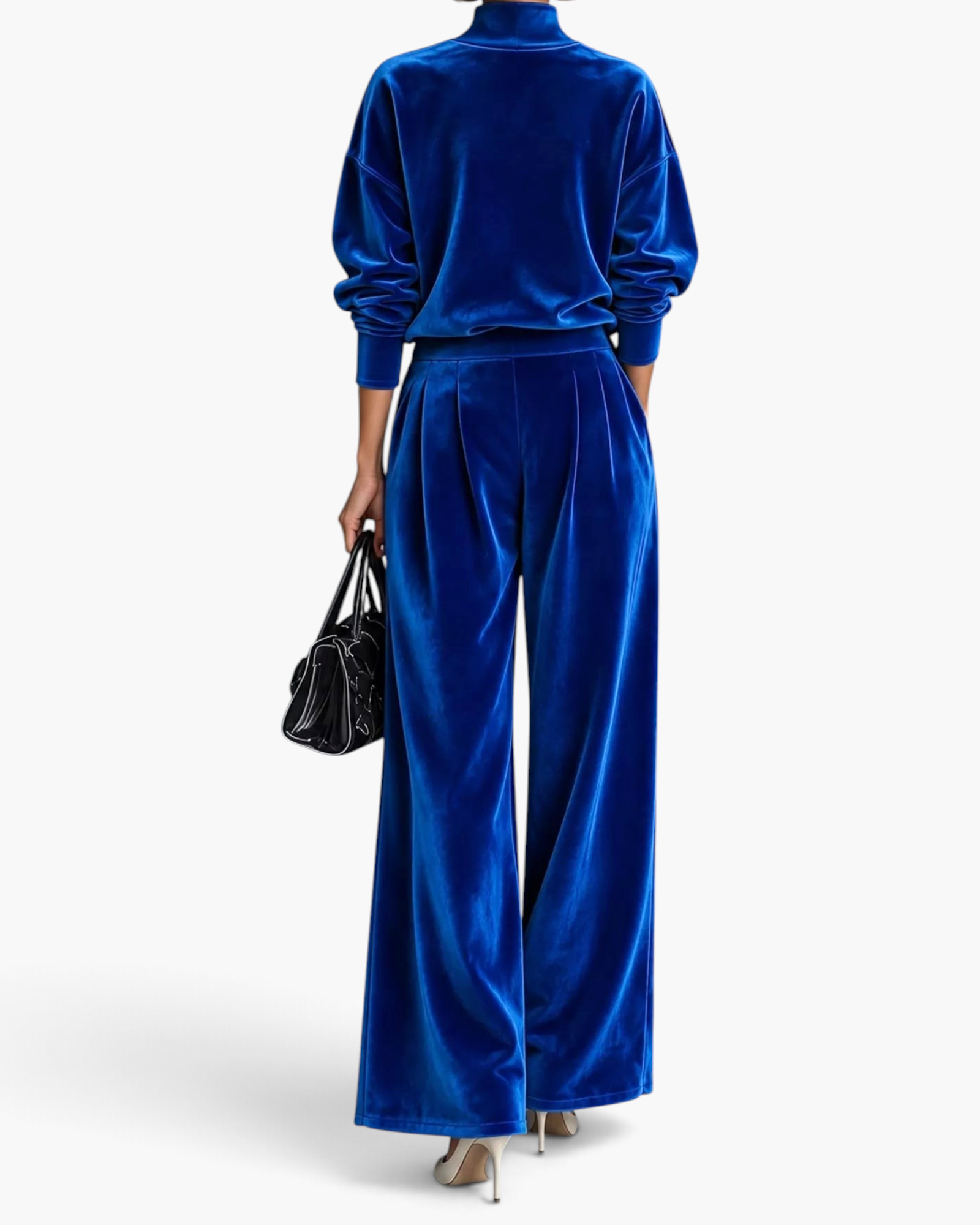 Beach Rose Co. royal blue velvet mock neck top and pleated wide leg pants set worn by a model from the back view.