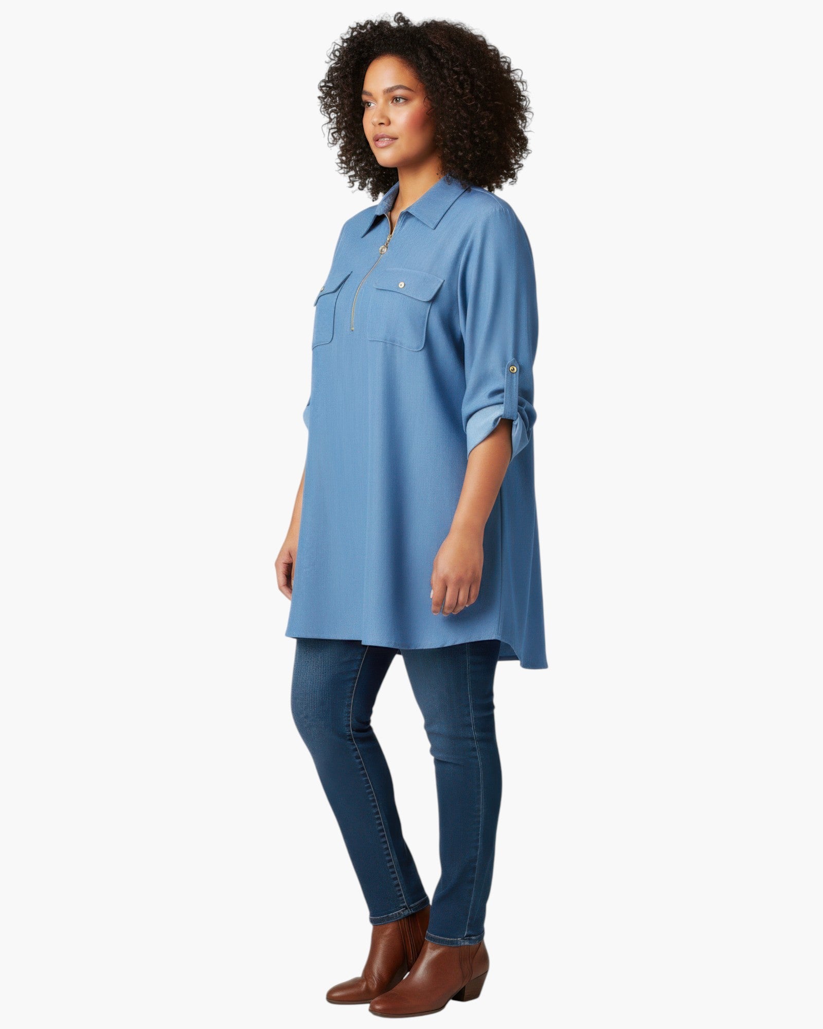 Beach Rose Co. blue zip-front tunic blouse with utility pockets and roll-tab sleeves worn by a model with jeans.