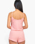 Beach Rose Co. blush pink ribbed strappy top and shorts set worn by a woman, back view showing soft jersey fabric.