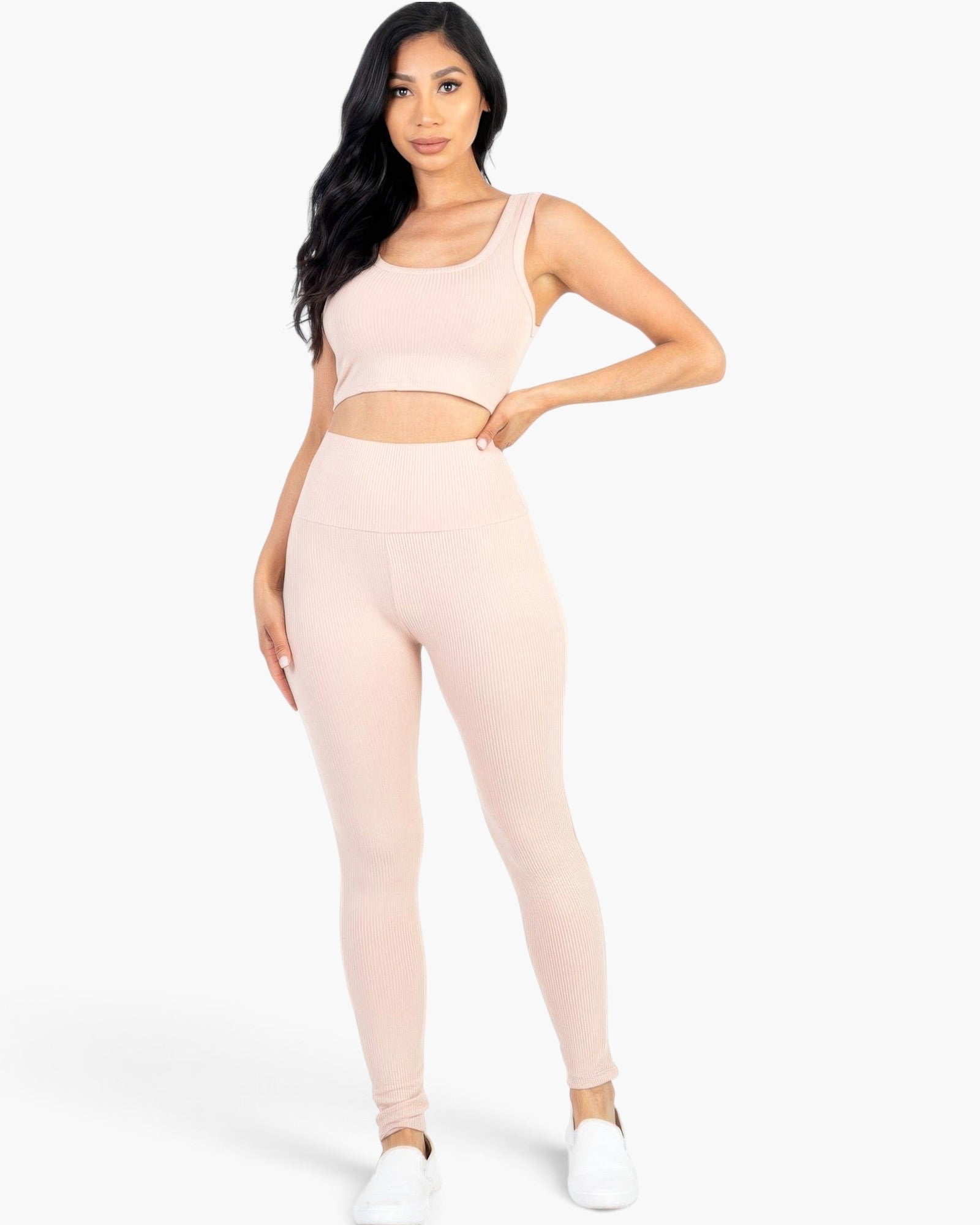Beach Rose Co. blush pink ribbed crop top and high-waisted leggings set worn by a model on a white background