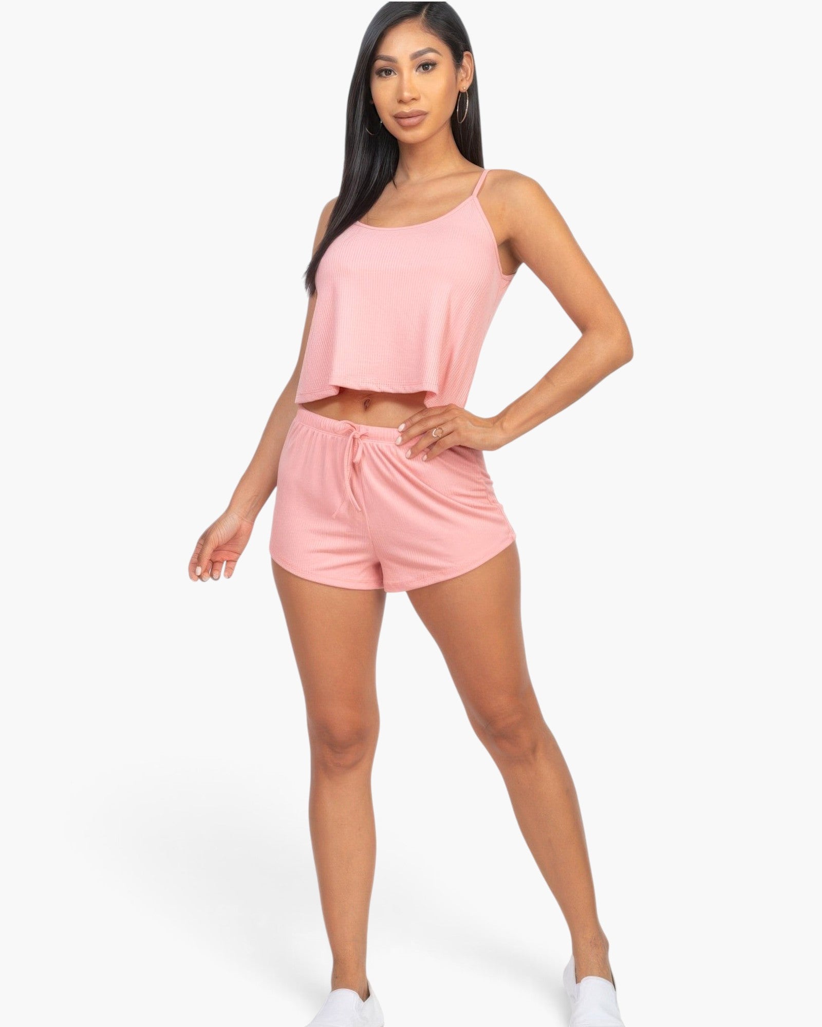 Beach Rose Co. blush pink ribbed strappy tank top and matching drawstring shorts set worn by a model.