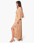 Beach Rose Co. bohemian maxi dress in shimmering lurex chiffon with a cape overlay and side slit, side profile view.