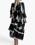 Beach Rose Co. black and white boho maxi dress with medallion print, tiered skirt, and three-quarter bell sleeves.
